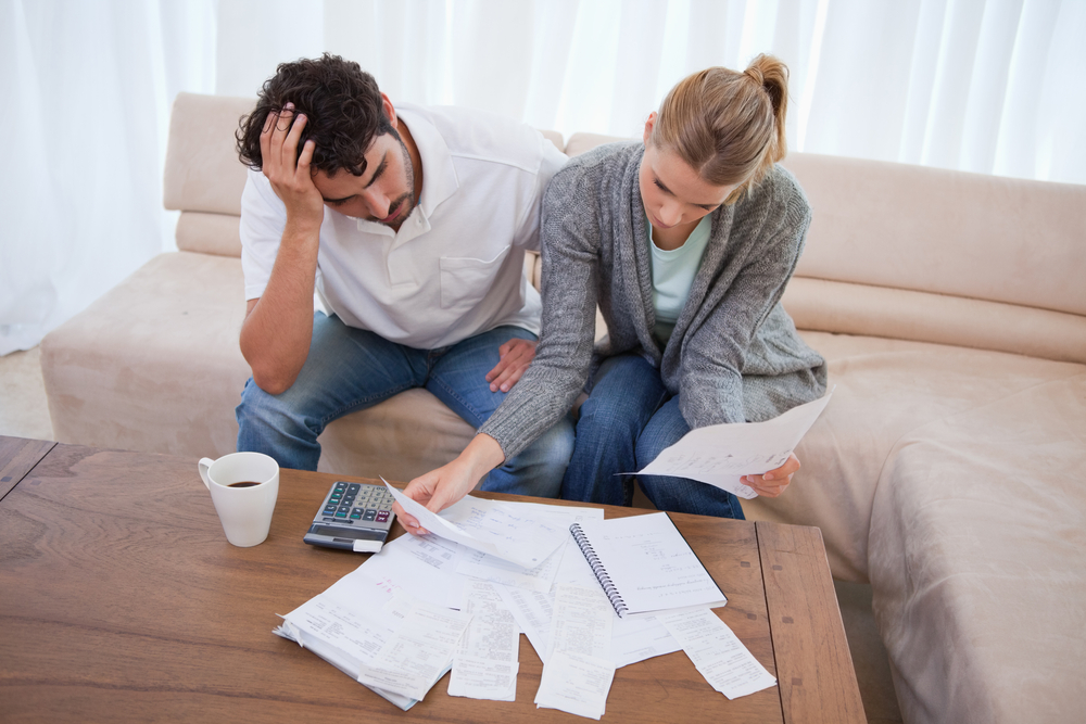 A couple struggling with debt in need of a Chino bankruptcy law firm