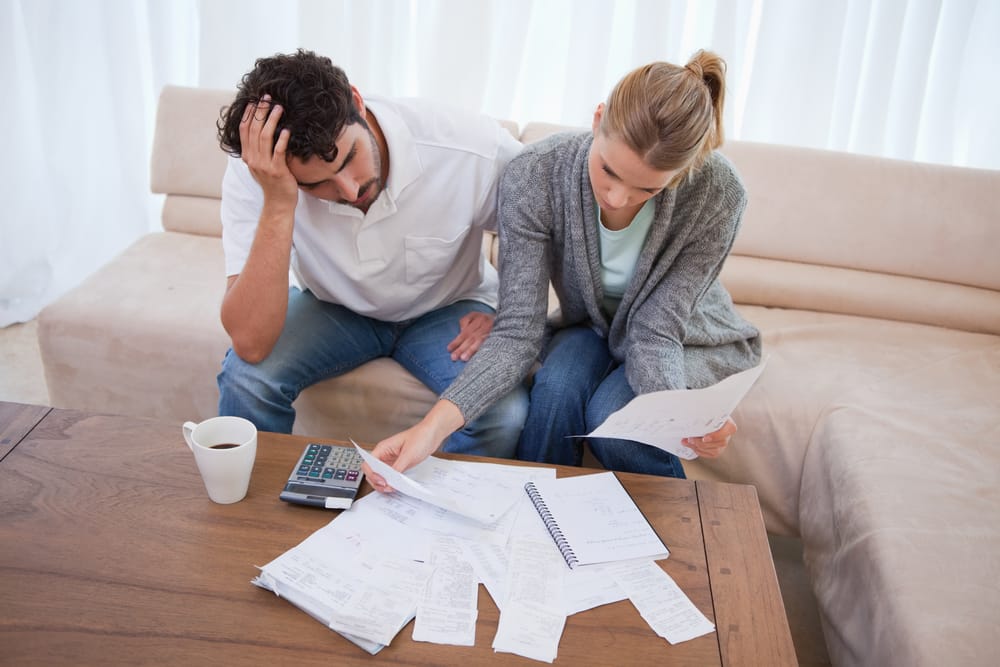 A couple struggling with debt in need of a Chino bankruptcy law firm