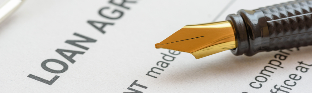 Worried friend or family member reviews loan documents with an attorney general, exploring options like refinancing after co-signing someone else's loan.