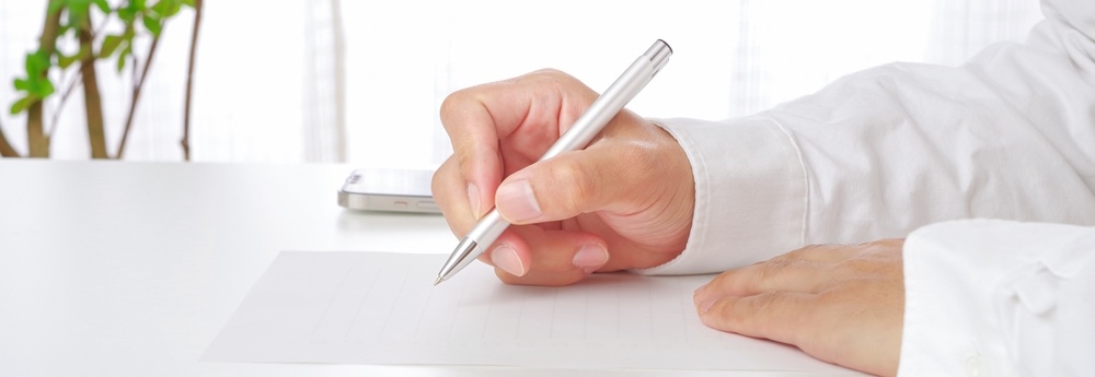 Close-up of a distressed person holding a credit report, highlighting the impact of co-signing an auto loan when the main borrower misses payments.