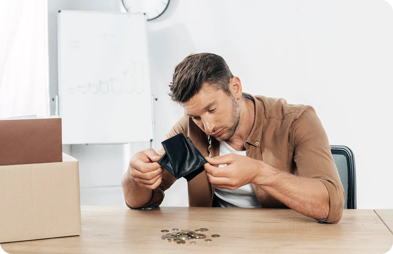 A person struggling with overwhelming debt and considering bankruptcy.